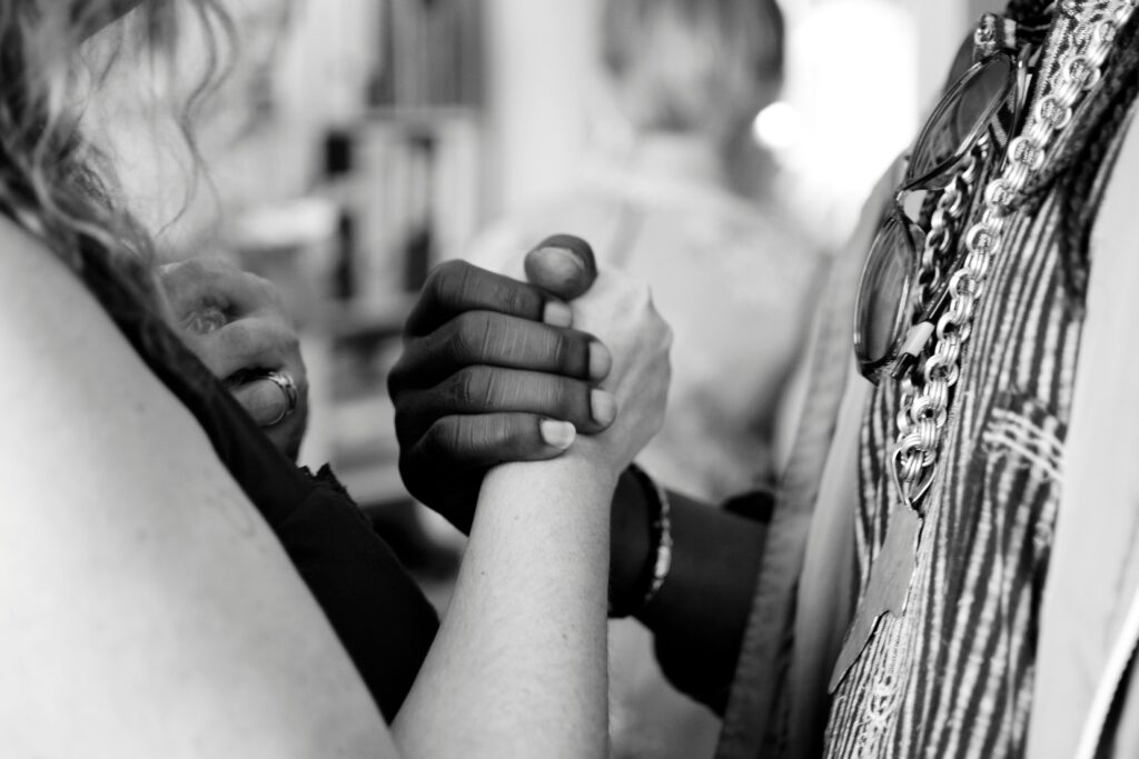 photo of a couples hands linked in strength because of couples therapy