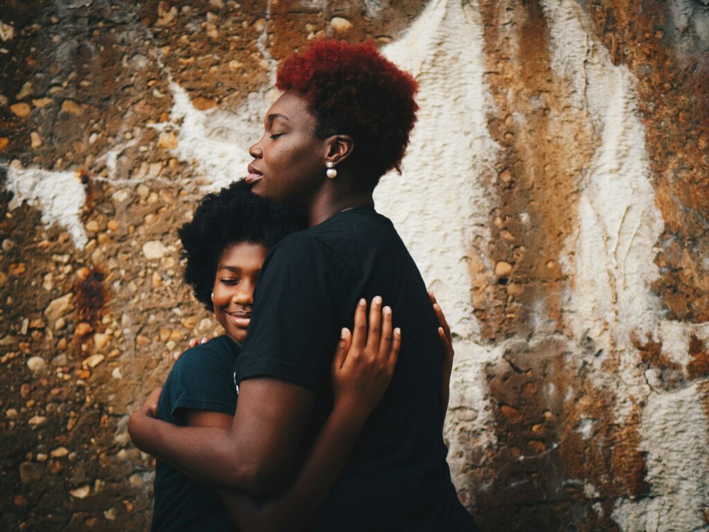 A couples embracing after family therapy focusing on communication and connection