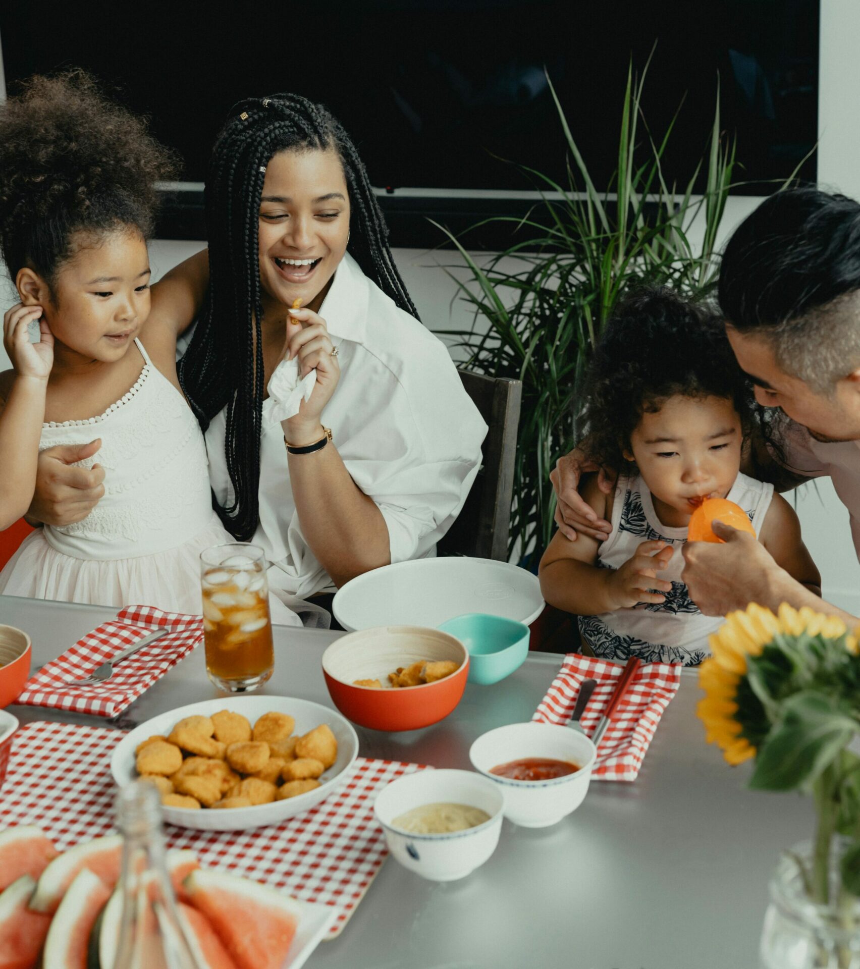 family eating around the table happily with successful family therapy