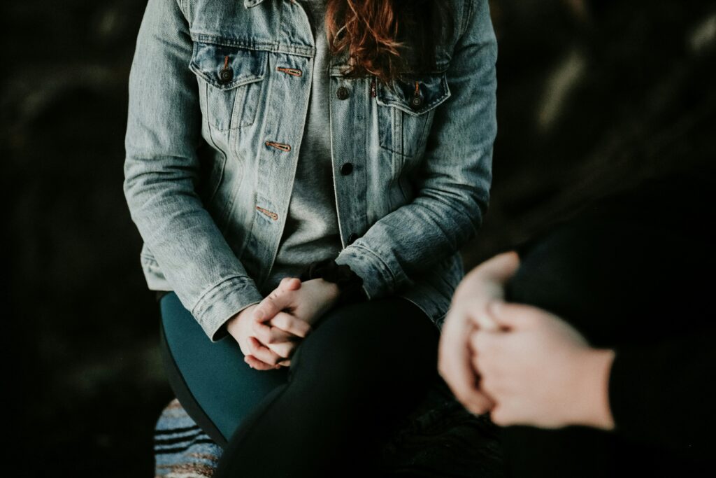 a person sitting in an individual therapy session with a counselor