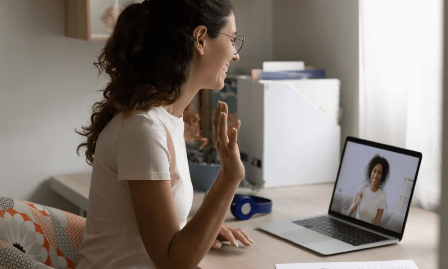 a woman enjoying an online therapy session with an expert counselor